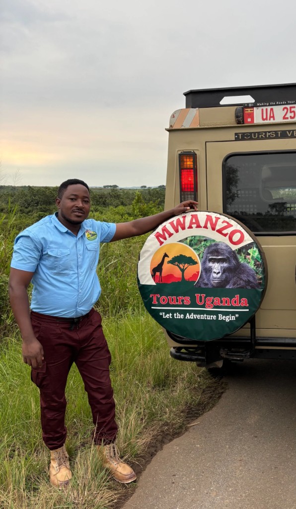 Anthony Kiweewa with a Mwanzo Tours safari vehicle